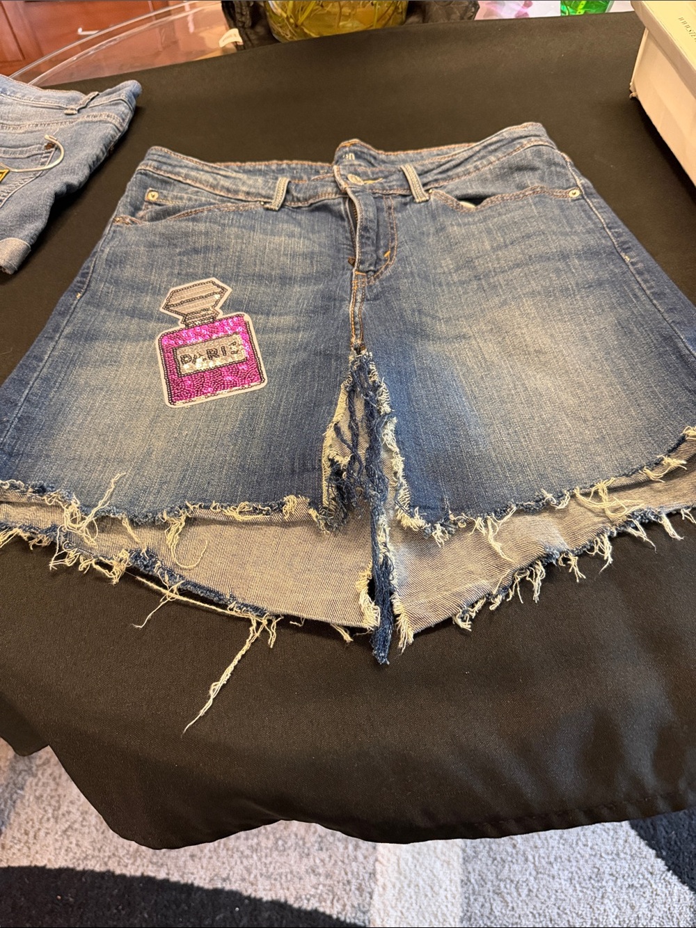 Frayed Denim Mini Skirt with Pink Patch
